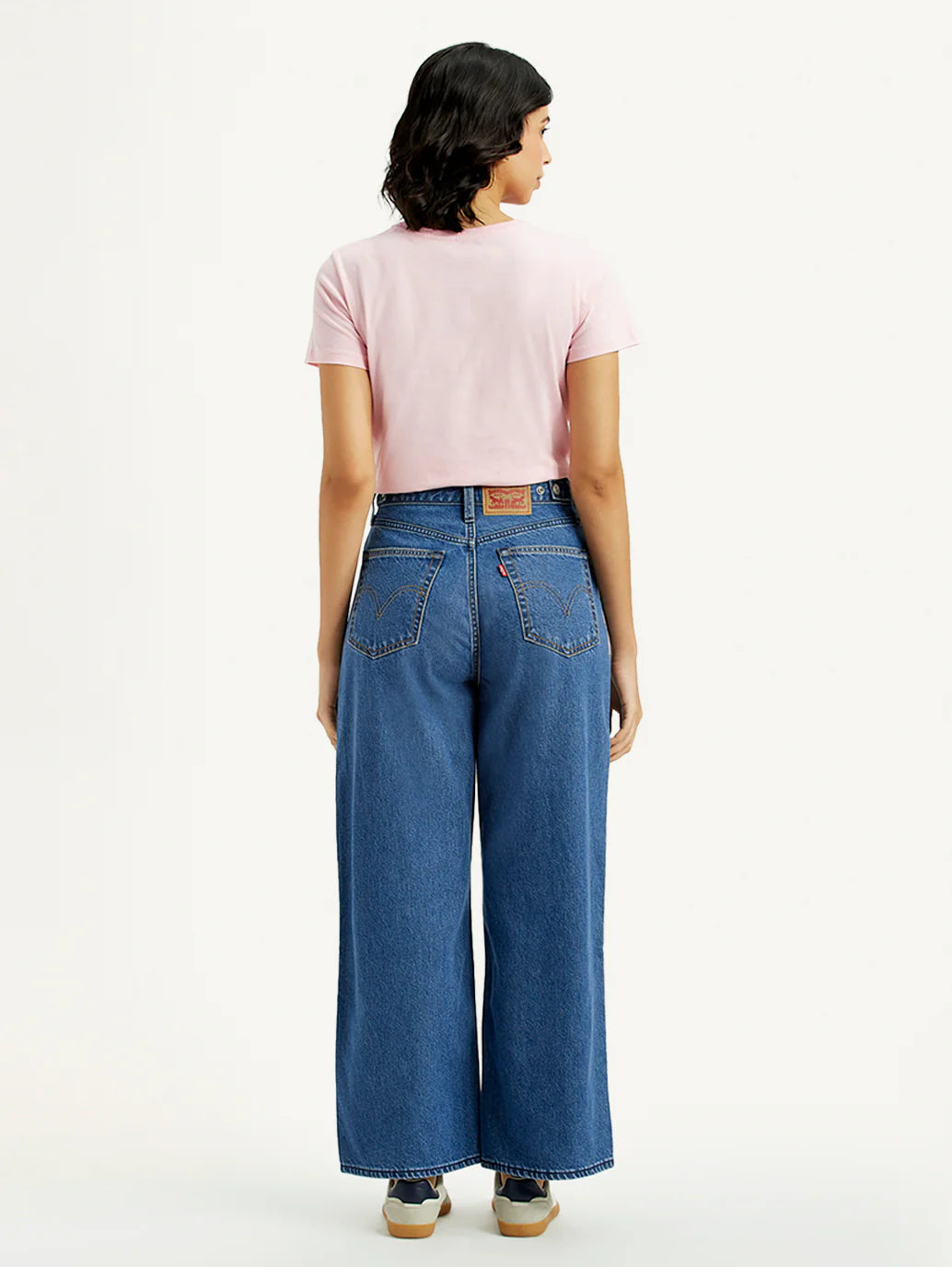 Trendy Medium Indigo Baggy Fit Jeans for Women with Mid-Rise Waist, Cinch Detailing, Soft Durable Fabric, and Modern Streetwear Appeal