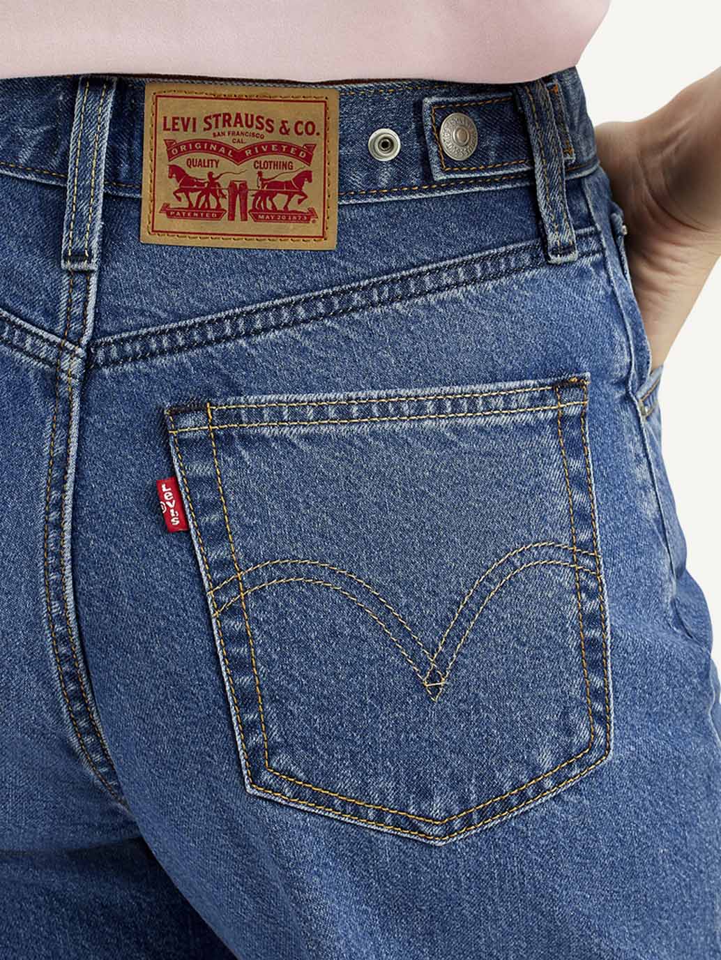 Trendy Medium Indigo Baggy Fit Jeans for Women with Mid-Rise Waist, Cinch Detailing, Soft Durable Fabric, and Modern Streetwear Appeal