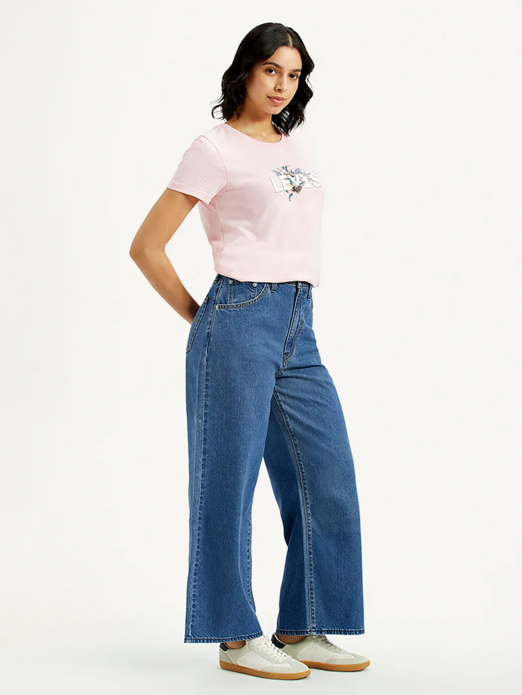 Trendy Medium Indigo Baggy Fit Jeans for Women with Mid-Rise Waist, Cinch Detailing, Soft Durable Fabric, and Modern Streetwear Appeal