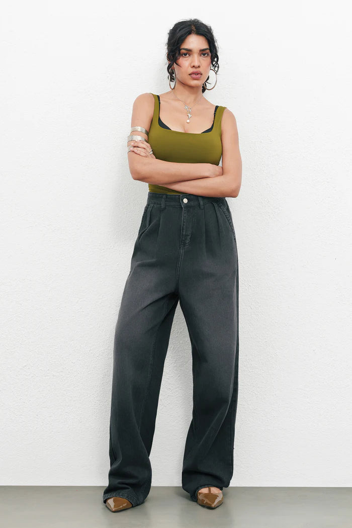 Fashionable Black Ink Fade Pleated Baggy Denim Pants for Women Offering Loose Fit, Soft Comfortable Fabric, and Versatile Urban Outfit Options