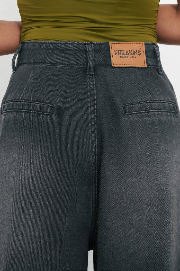 Fashionable Black Ink Fade Pleated Baggy Denim Pants for Women Offering Loose Fit, Soft Comfortable Fabric, and Versatile Urban Outfit Options