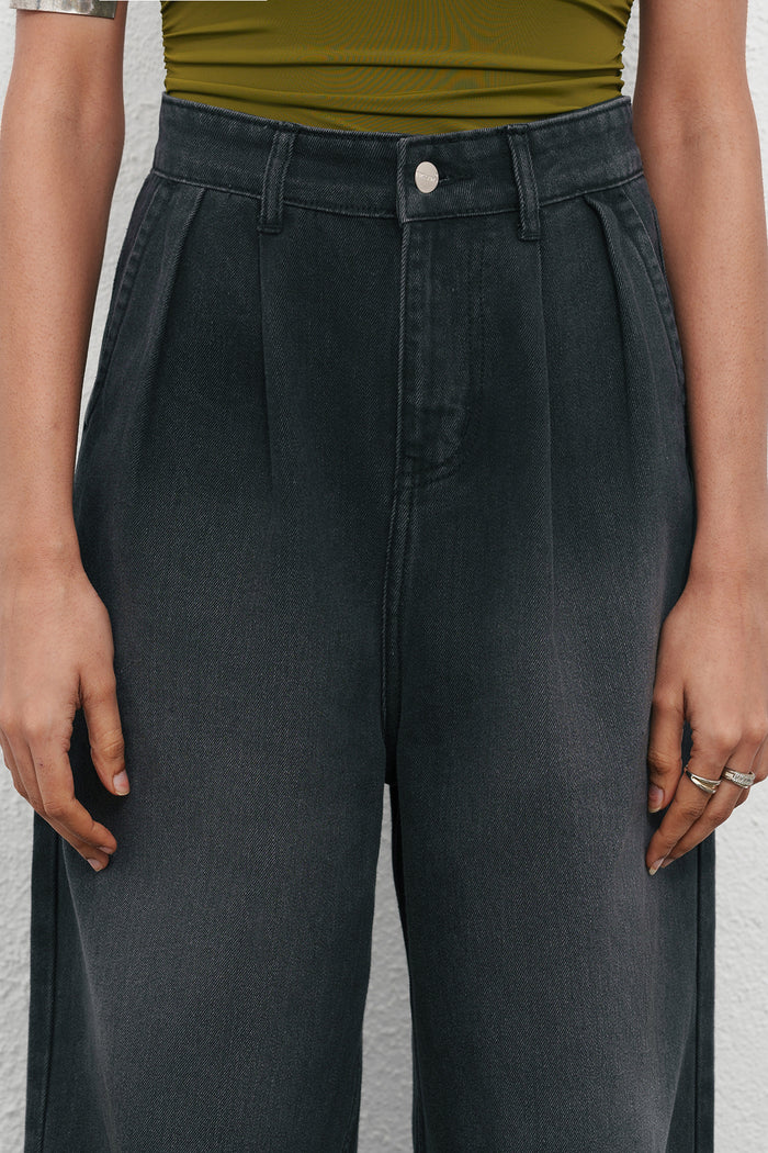 Fashionable Black Ink Fade Pleated Baggy Denim Pants for Women Offering Loose Fit, Soft Comfortable Fabric, and Versatile Urban Outfit Options